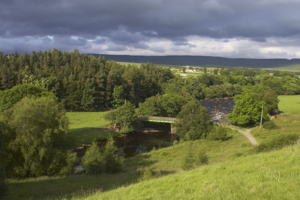 England, County Durham, River Tees. The River Tees and the north Pennines, downstream of the High Force falls in County Durham.