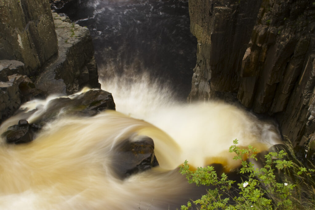 England, County Durham, High Force. The River Tees cascades down the High Force waterfall in County Durham.