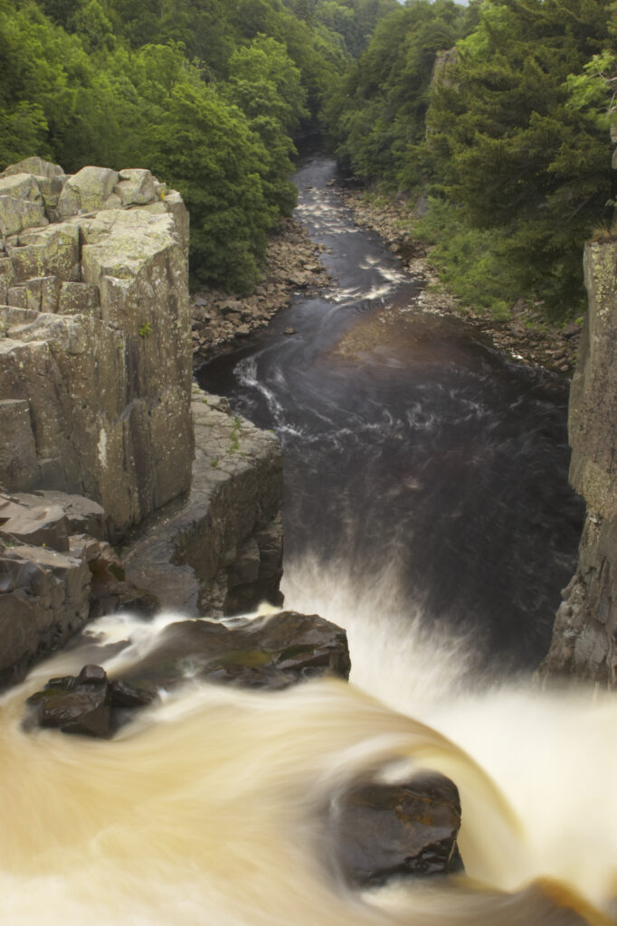 England, County Durham, High Force. The River Tees cascades down the High Force waterfall in County Durham.