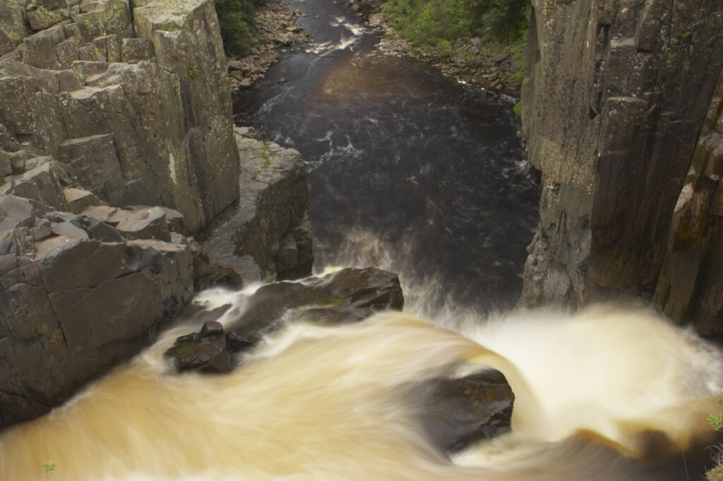England, County Durham, High Force. The River Tees cascades down the High Force waterfall in County Durham.