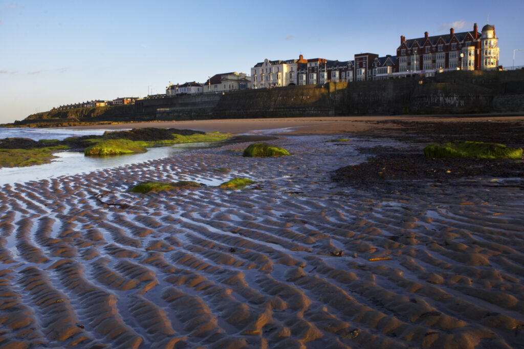 England Tyne and Wear, Whitley Bay. The Rex hotel and the golden sands of the Whitley Bay sea front.