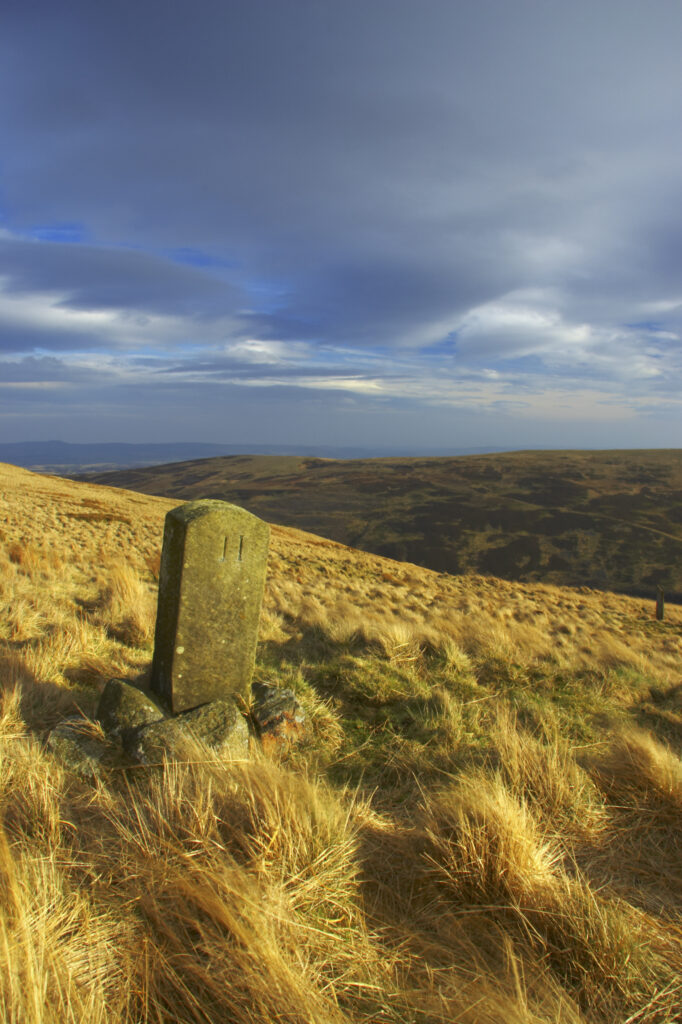 England, Northumberland, Northumberland National Park. Milestone on the banks of Snear Hill, high above the Harthope Valley.