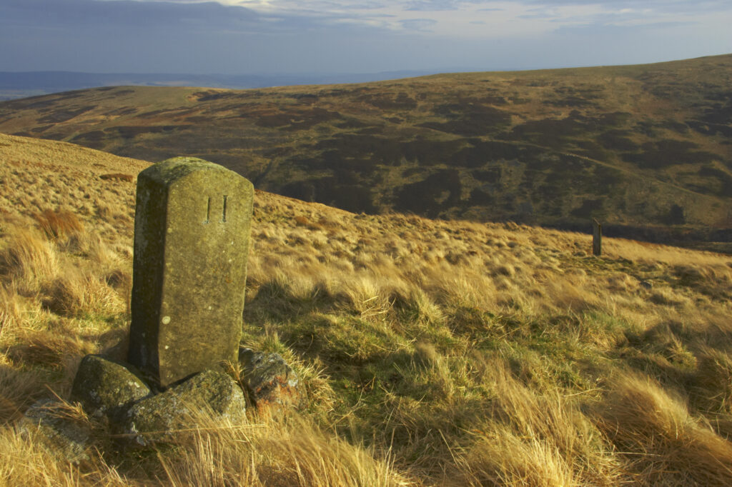 England, Northumberland, Northumberland National Park. Milestone on the banks of Snear Hill, high above the Harthope Valley.