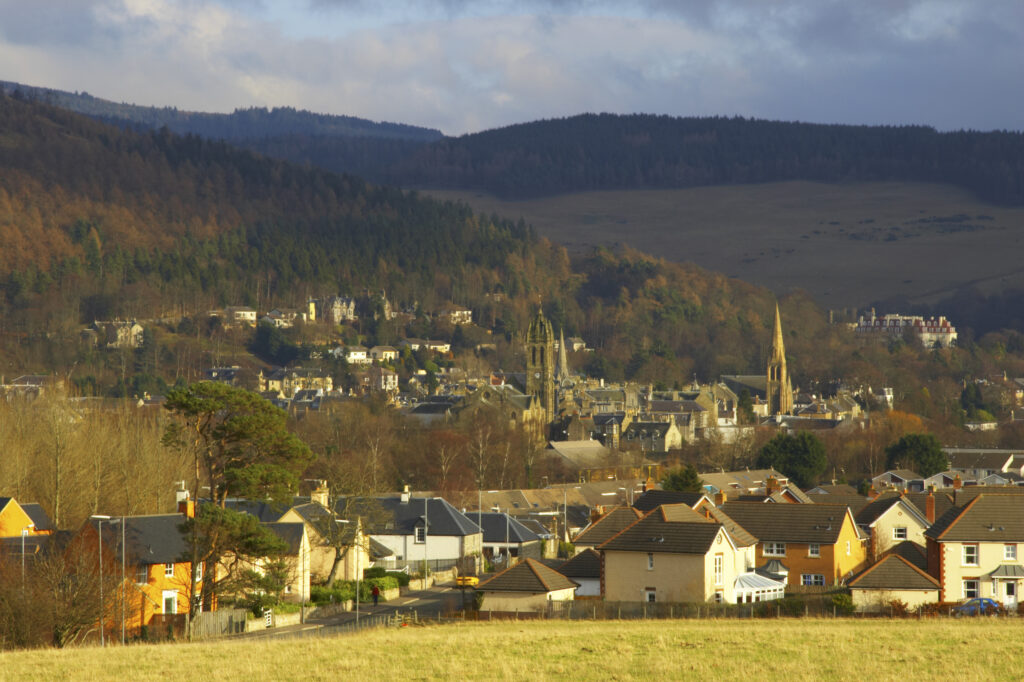 Scotland, Scottish Border, Peebles. The Scottish Borders town of Peebles against a backdrop of dramatic hills.