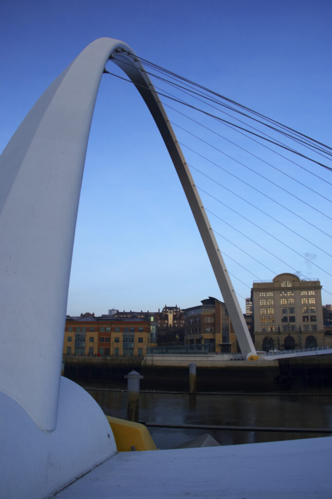 England, Tyne & Wear, Newcastle Upon Tyne. The Millennium Bridge and the river Tyne, viewed from the Gateshead quayside.