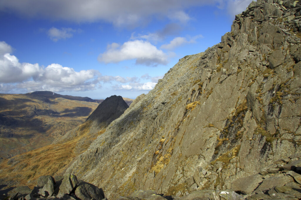 Wales, Caernarfonshire, Snowdonia National Park. The dramatic landscape surrounding the mountain peak of Tryfan, viewed from the lower slopes of Glyder Fawr.