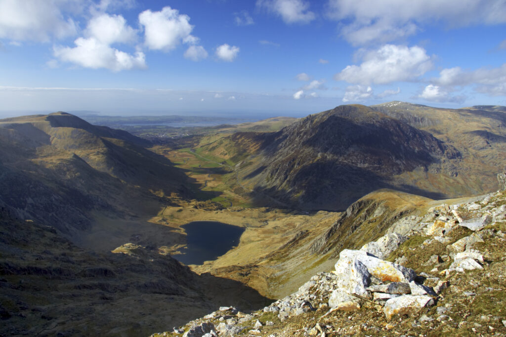 Wales, Caernarfonshire, Snowdonia National Park. The dramatic landscape of the Ogwen Valley, viewed from the lower slopes of Glyder Fawr.