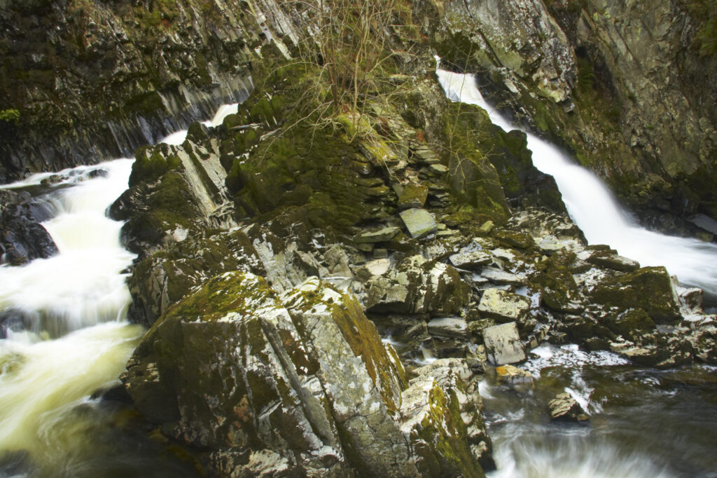 Wales, Caernarfonshire, Snowdonia National Park. The fast flowing waters of the Conwy Falls.
