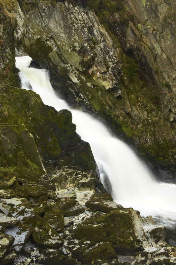 Wales, Caernarfonshire, Snowdonia National Park. The fast flowing waters of the Conwy Falls.