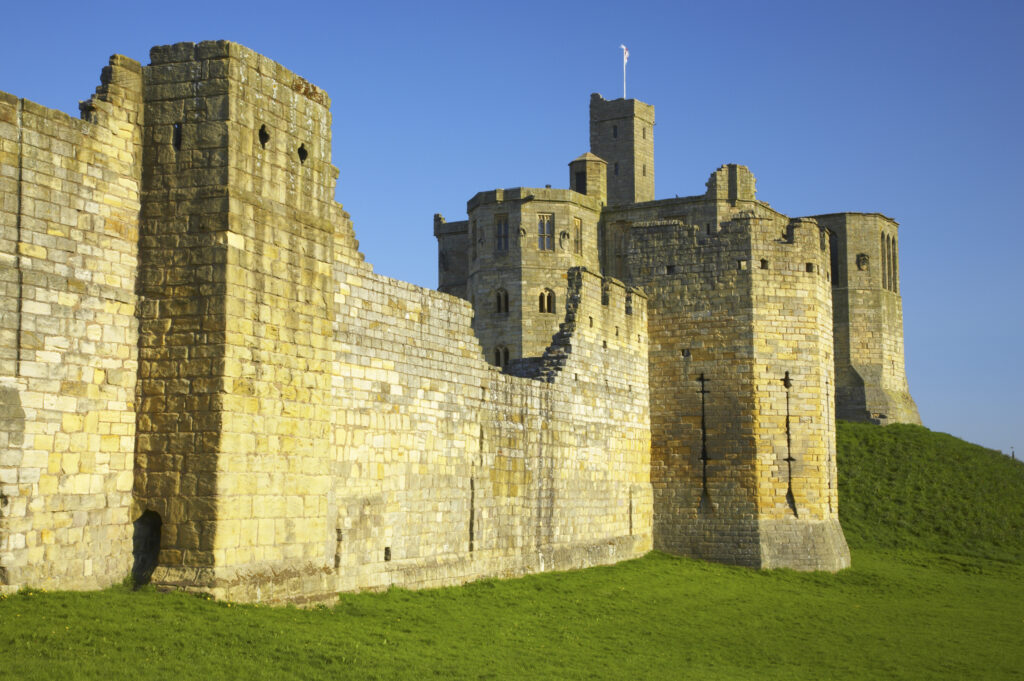England, Northumberland, Warkworth Castle. Warkworth Castle (English Heritage), a magnificent 12th century stone motte and bailey fortress, located near the Northumberland Heritage Coast.