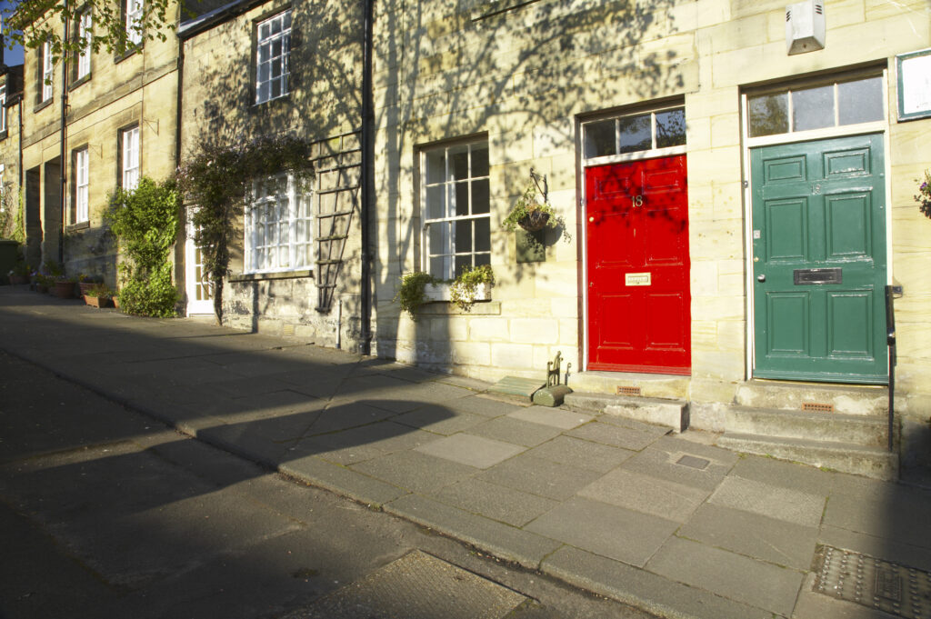 England, Northumberland, Warkworth. A row of terraced houses in Warkworth Village, located near the Northumberland Heritage Coast.