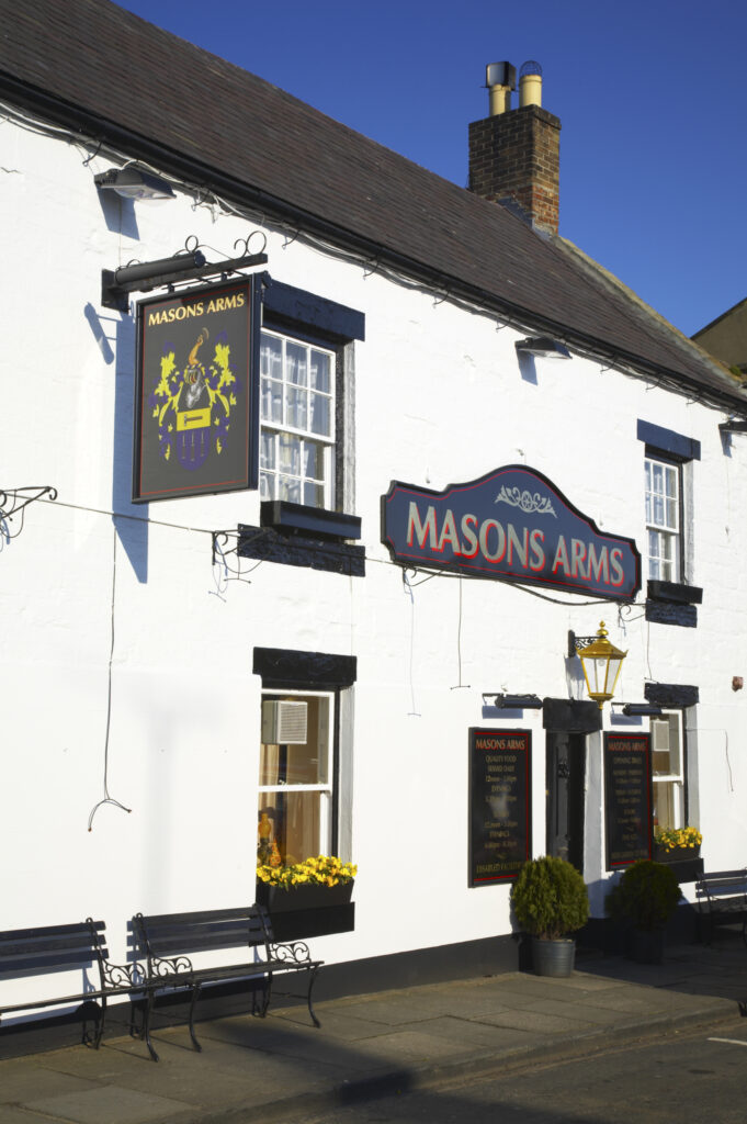 England, Northumberland, Warkworth. The Masons Arms Inn, a traditional English pub located in Warkworth Village, near the Northumberland Heritage Coast.