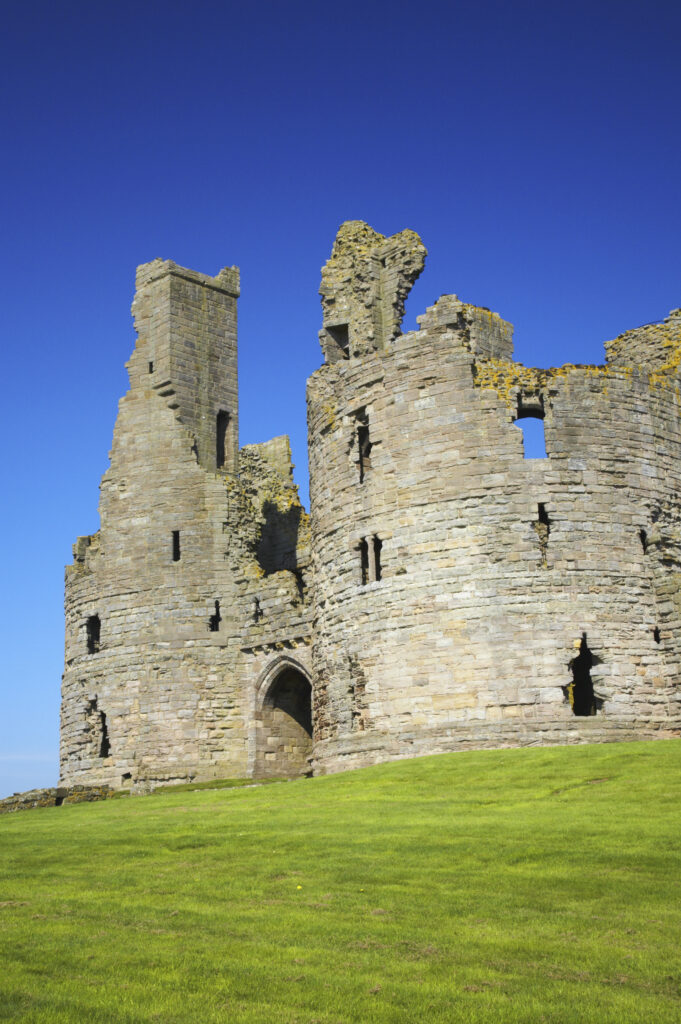 England, Northumberland, Dunstanburgh Castle. The ruins of the impressive Dunstanburgh Castle (National Trust / English Heritage) located along the Northumberland Heritage Coast near Craster.