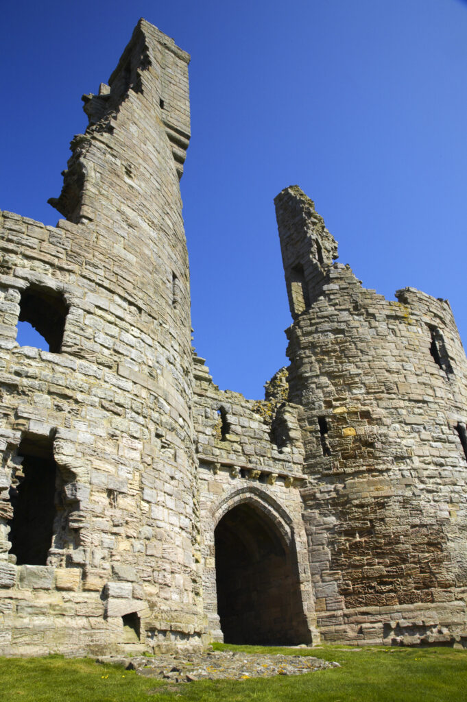 England, Northumberland, Dunstanburgh Castle. The ruins of the impressive Dunstanburgh Castle (National Trust / English Heritage) located along the Northumberland Heritage Coast near Craster.