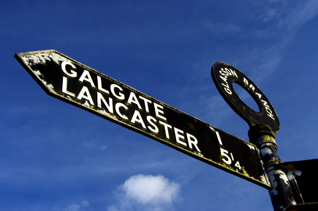 England, Lancashire, Galgate. Sign post indicating route of canal and towpath near Galgate and Lancaster.