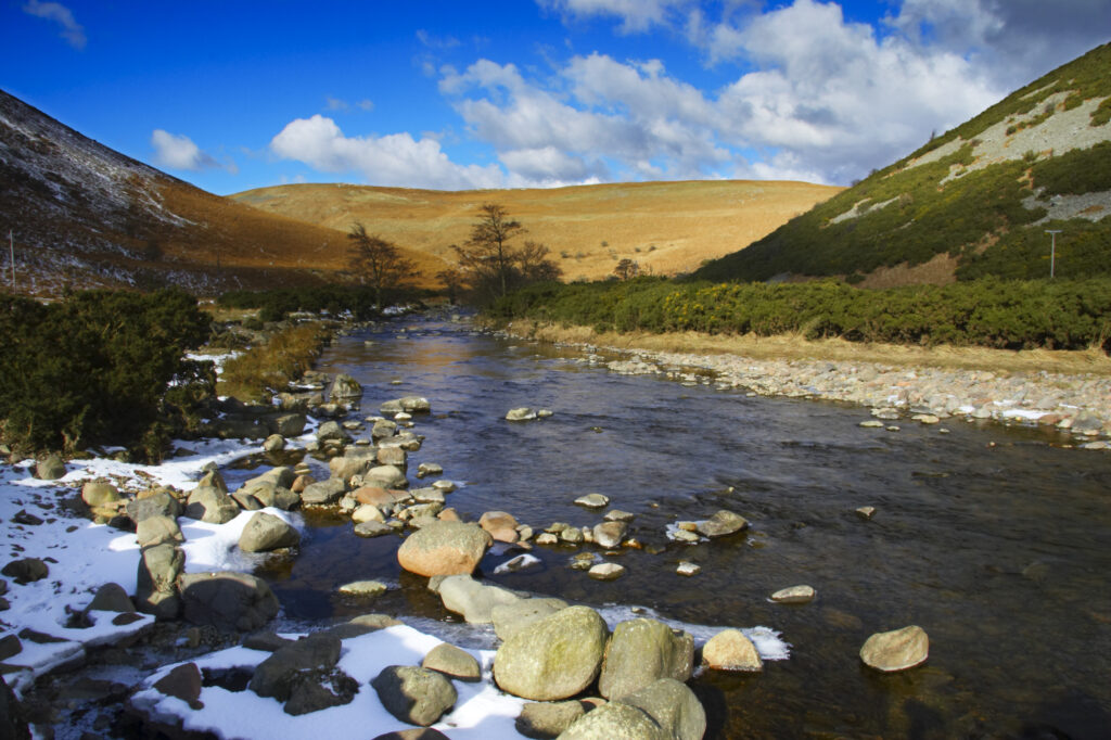 England, Northumberland, Northumberland National Park. A winter scene with the remains of snow on the river Breamish, running through the Cheviots and the Breamish valley near the village of Ingram situated within the Northumberland National Park in the northen england county of Northumberland about 8km east of the border with Scotland.