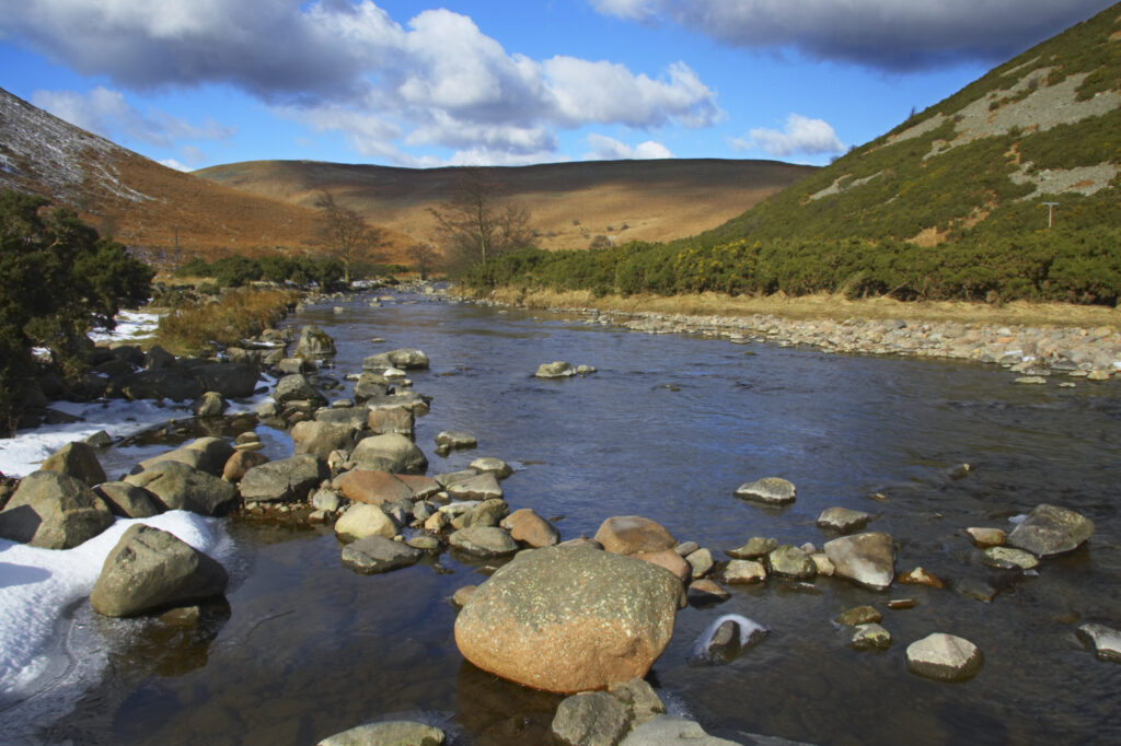England, Northumberland, Northumberland National Park. A winter scene with the remains of snow on the river Breamish, running through the Cheviots and the Breamish valley near the village of Ingram situated within the Northumberland National Park in the northen england county of Northumberland about 8km east of the border with Scotland.