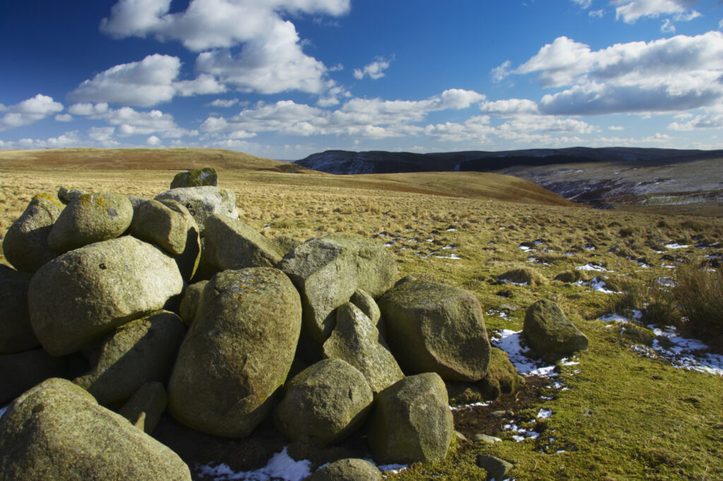 England, Northumberland, Northumberland National Park. A winter scene with a cairn of rocks / boulders found at the foothills of the Cheviots and the Breamish valley near the village of Ingram situated within the Northumberland National Park in the northen england county of Northumberland about 8km east of the border with Scotland.