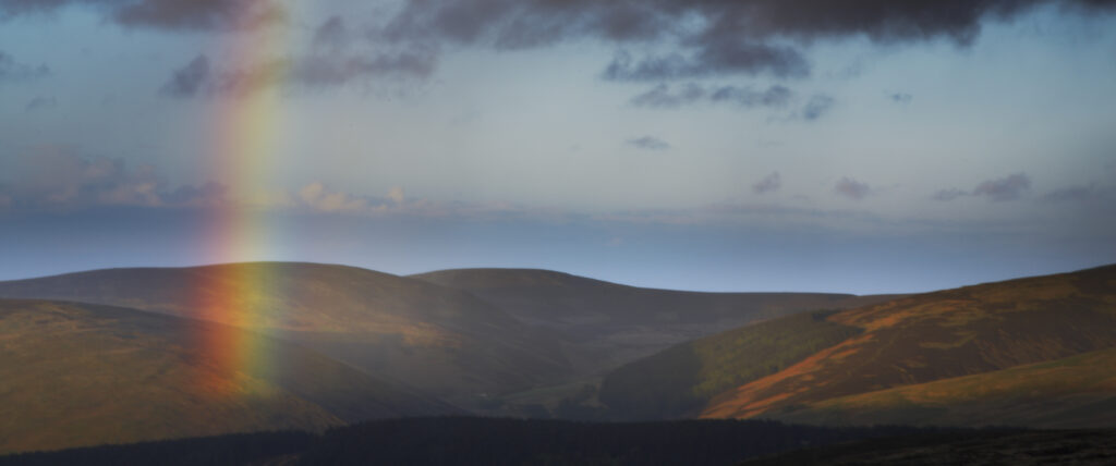 England, Northumberland, The Pennine Way. A rainbow above the Cheviots near the England / Scottish Border.
