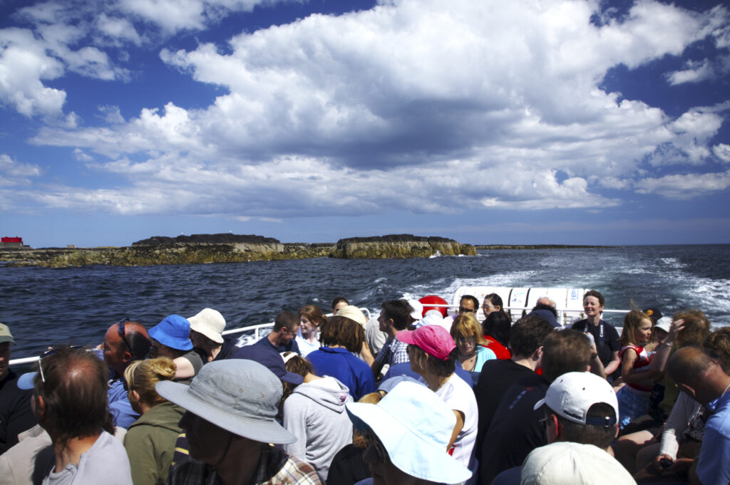 England Northumberland Farne Islands Tourists on the Glad Tidings boat trip to the Farne Islands from Seahouses