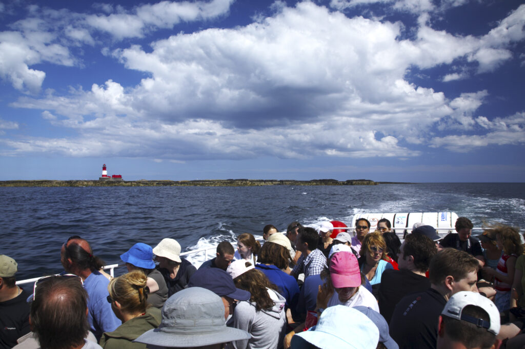 England Northumberland Farne Islands Tourists on the Glad Tidings boat trip to the Farne Islands from Seahouses
