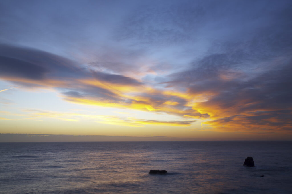 England, Tyne and Wear, Marsden Bay. Sunrise over the North Sea, near Lizard Point and Marsden Bay.