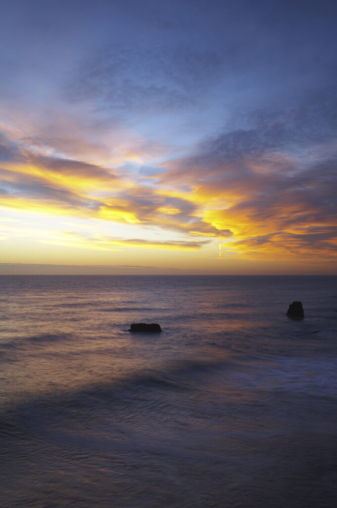 England, Tyne and Wear, Marsden Bay. Sunrise over the North Sea, near Lizard Point and Marsden Bay.