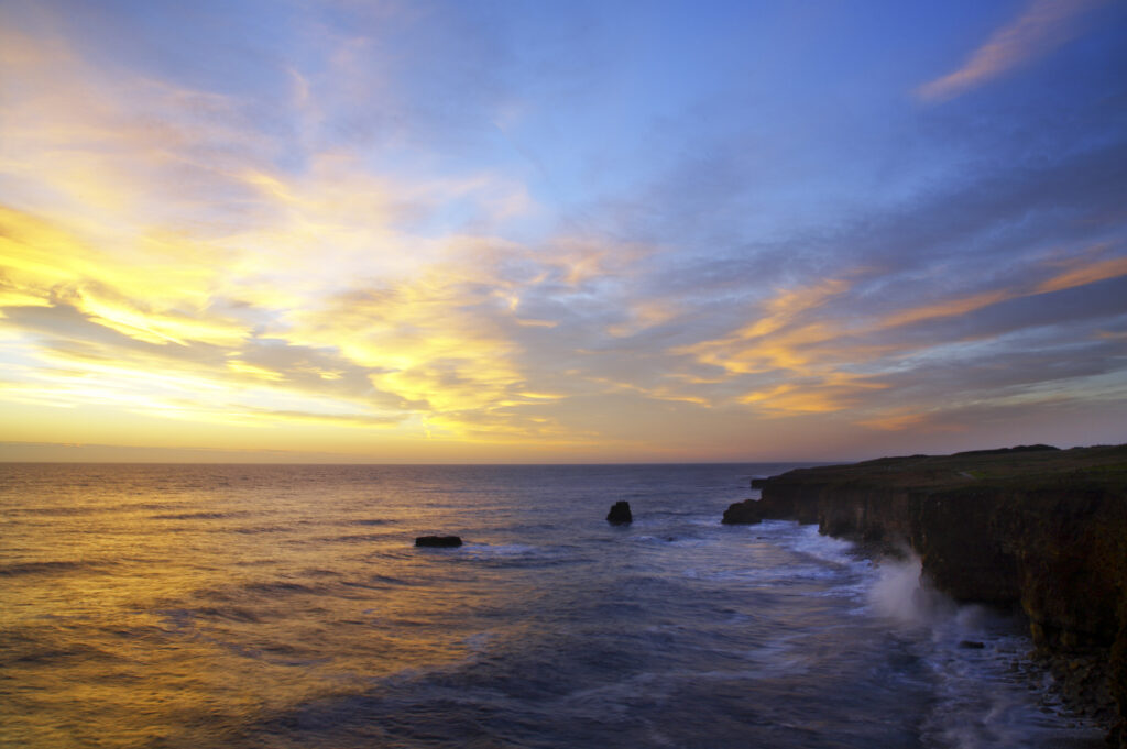 England, Tyne and Wear, Marsden Bay. Sunrise over the North Sea, near Lizard Point and Marsden Bay.