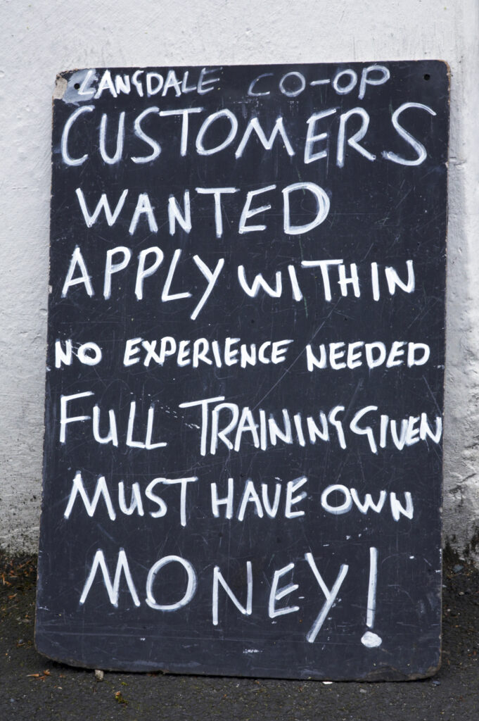 England, Cumbria, The Lake District National Park. A sign outside a shop in the village of Chapel Stile.