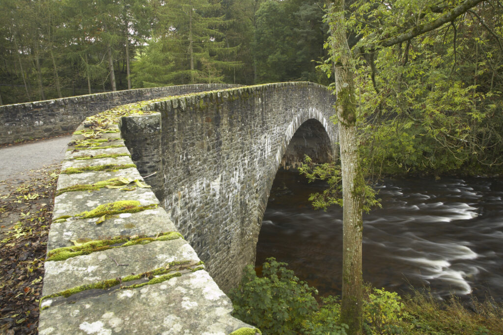 Scotland, Scottish Borders, The River Ettrick. A stone bridge over the fast flowing River Ettrick.