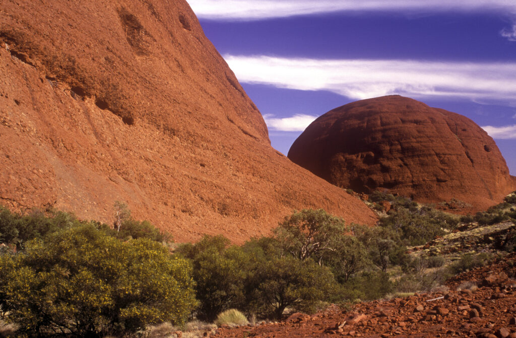 AUSTRALIA, Northern Territory, Uluru-Kata Tjuta Naional Park. The vibrant red colours of the Olgas, a popular tourist spot within the park