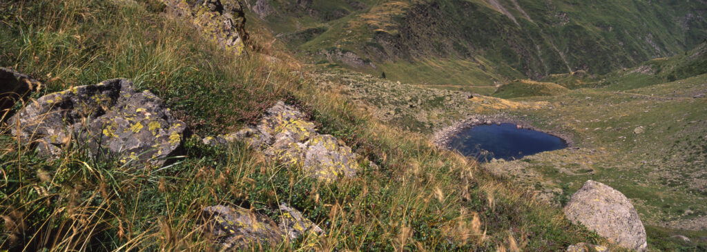FRANCE, Midi Pyrenees, Pyrenees National Park. The rocky landscape of the alpine environment surrounding the Lac d Ilheou