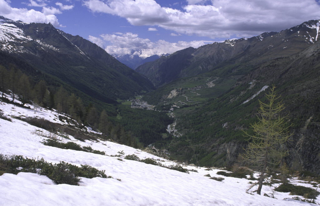 ITALY, Valle d'Aosta, Gran Paradiso National Park. Snow remains well into spring in the peaks of the mountain landscape of the western Alps above the Lillaz valley.