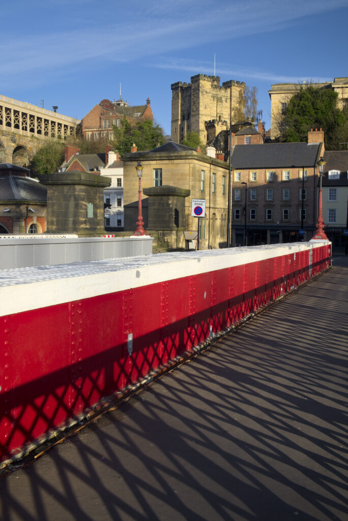 England, Tyne and Wear, Newcastle Upon Tyne. The Newcastle Swing Bridge (crossing the River Tyne) with the Newcastle Castle Keep in the distance.