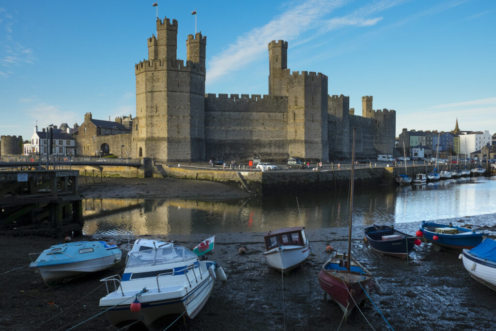 Wales, Gwynedd, Caernarfon Castle. Caernarfon Castle, a popular tourist attraction along the North Wales Coast.