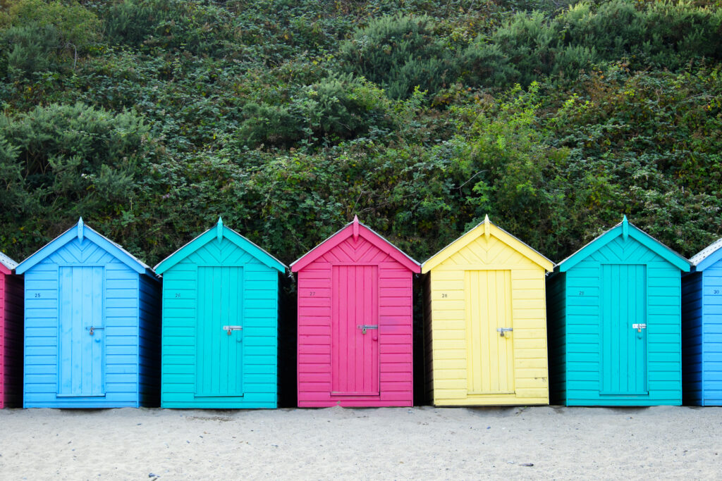 Wales, LLeyn Peninsula, Traeth Llanbedrog. Colourful beach huts loacted on Llanbedrog Beach on the LLeyn Peninsula.