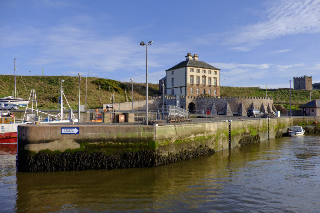 Scotland, Scottish Borders, Eyemouth. Gunsgreen house overlooking the traditional fishing harbour at Eyemouth.
