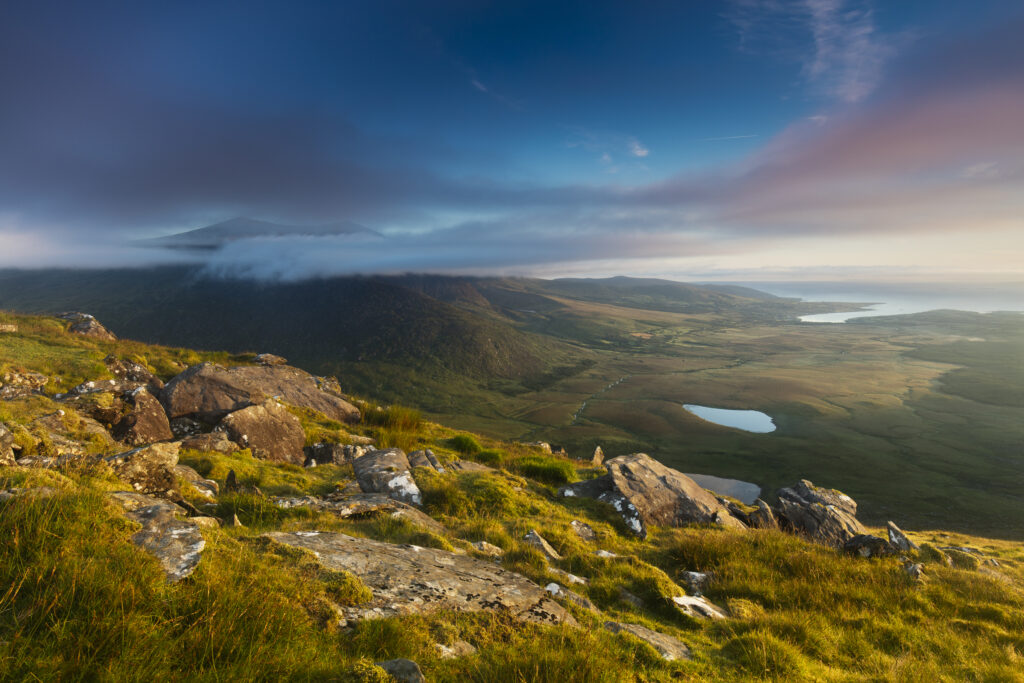 Republic of Ireland, County Kerry, Conor Pass. Early morning view from Connor Hill looking towards Brandon Peak and Brandon Bay on the Dingle Peninsula.