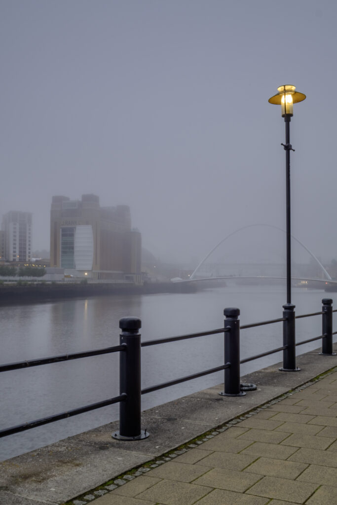 England, Tyne and Wear, Newcastlle Upon Tyne. Fog on the tyne, with the Newcastle Quayside and Gateshead Baltic in view.