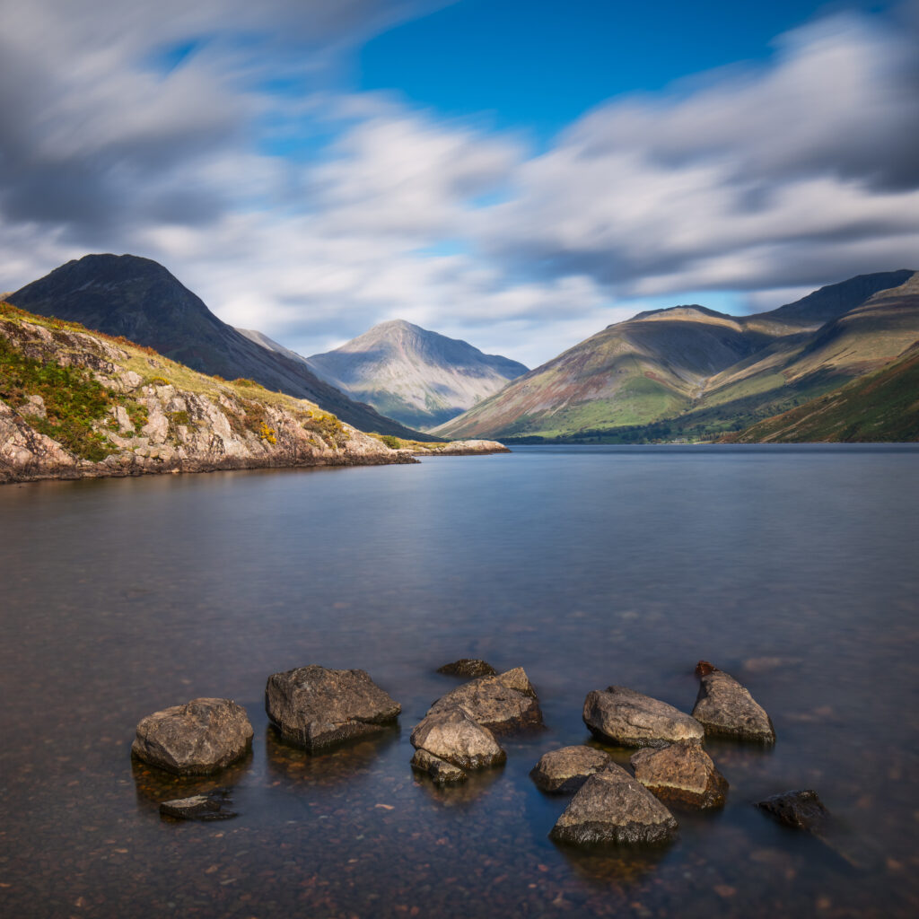 England, Cumbria, Lake District National Park. Fast moving clouds above Wasdale viewed from Wastwater - The deepest lake in England.