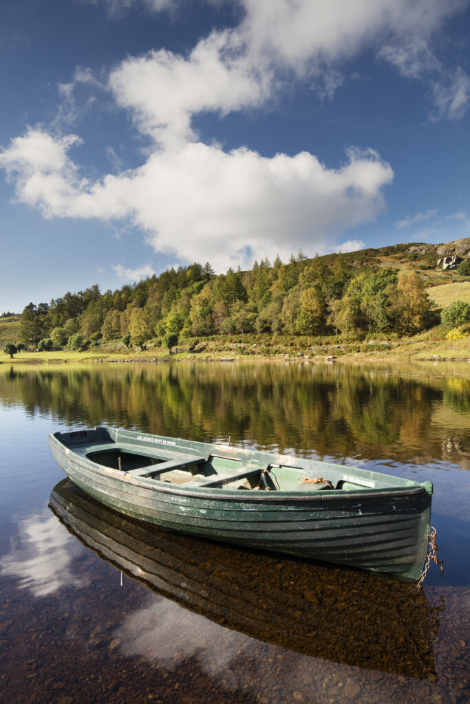 England, Cumbria, Lake District National Park. Fishing boat moored on Watendlath Tarn, which is located high between the Borrowdale and Thirlmere valleyy.