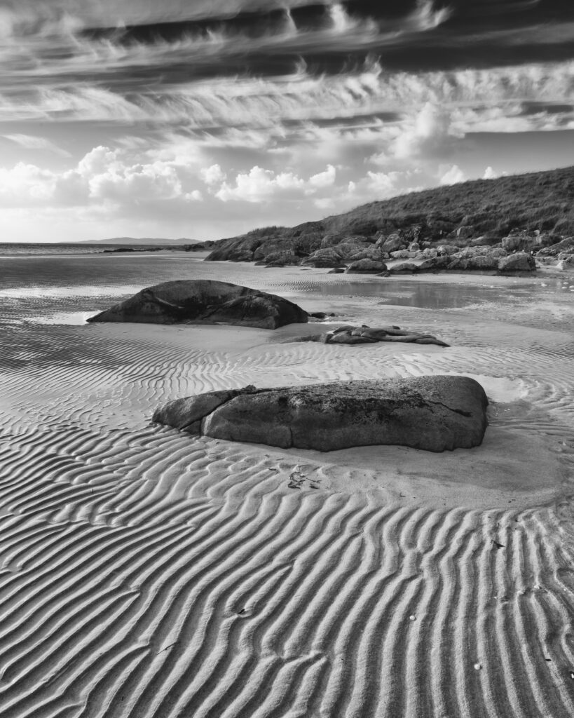 Scotland, The Isle of Harris, Lusketyre Bay. Late afternoon light illuminates the sand ripples of the Lusketyre Bay on the Luskentyre peninsula.