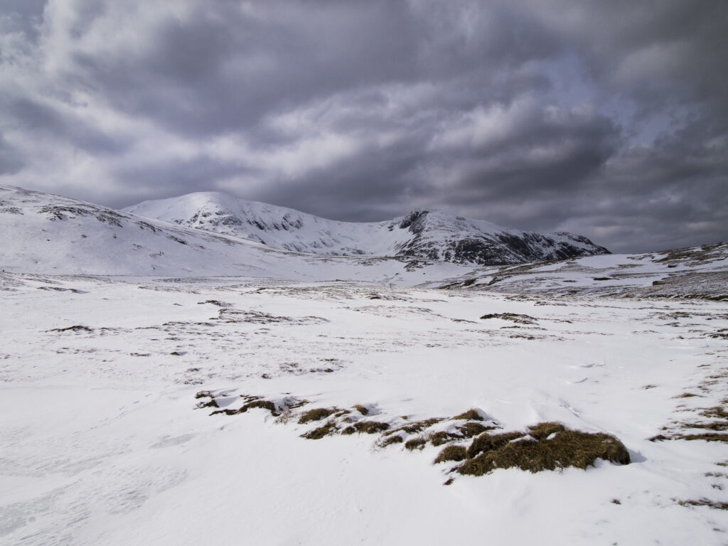 Scotland, Scottish Highlands, Glencoe. Storm clouds above the Glencoe Mountain Resort - A popular skiing and snowboarding ski field in the West Highlands.