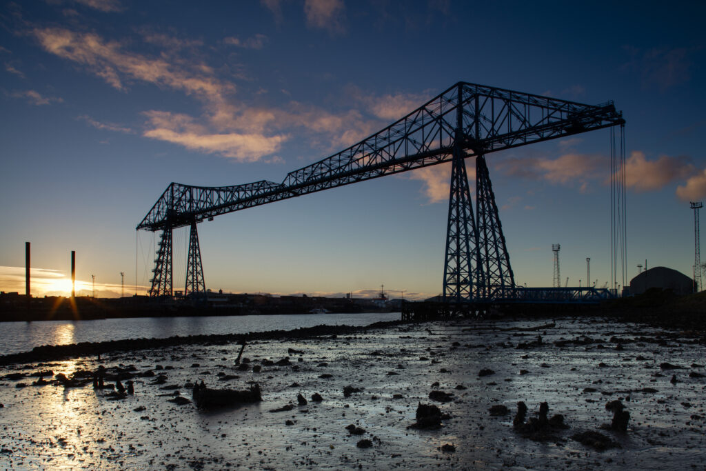 England, Middlesbrough, Middlesbrough Transporter Bridge. The Tees Transporter Bridge (Middlesbrough Transporter Bridge) which carries a travelling 'car', or 'gondola', suspended from the bridge, across the river Tees in 90 seconds.