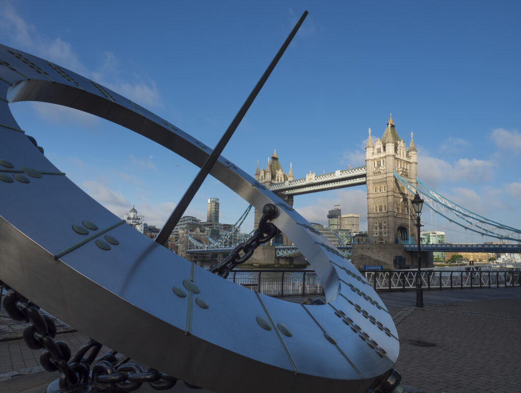 England, Greater London, London Borough of Tower Hamlets. Sun dial near the entrance to the St Katharine Docks, on the north bank of the River Thames near the London Tower Bridge.