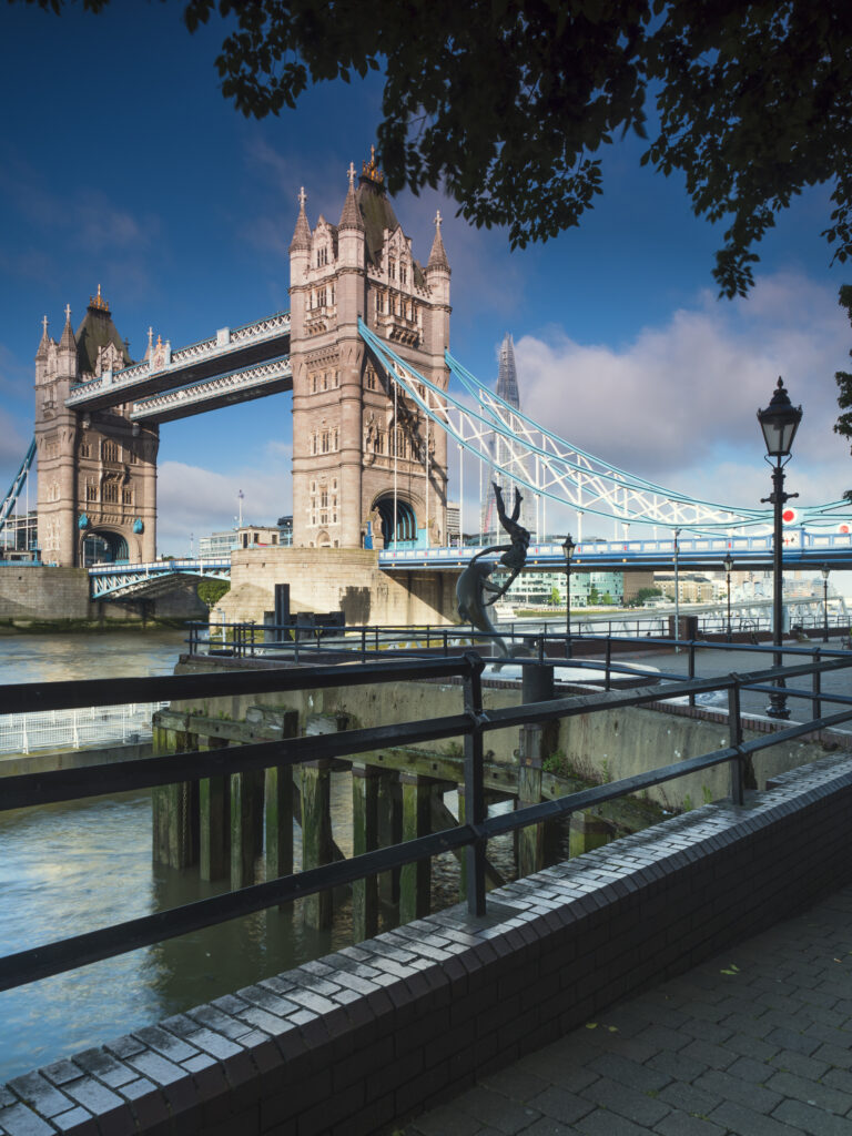 England, Greater London, London Borough of Tower Hamlets. View from the entrance to the St Katharine Docks, on the north bank of the River Thames looking towards the London Tower Bridge.