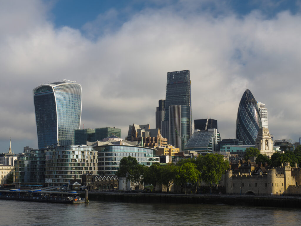 England, Greater London, London City. The Tower of London with a backdrop of the financial district of the city of London, with the iconic 'Gherkin', 'Walkie-Talkie' and 'Cheesegrater ' buildings in view.