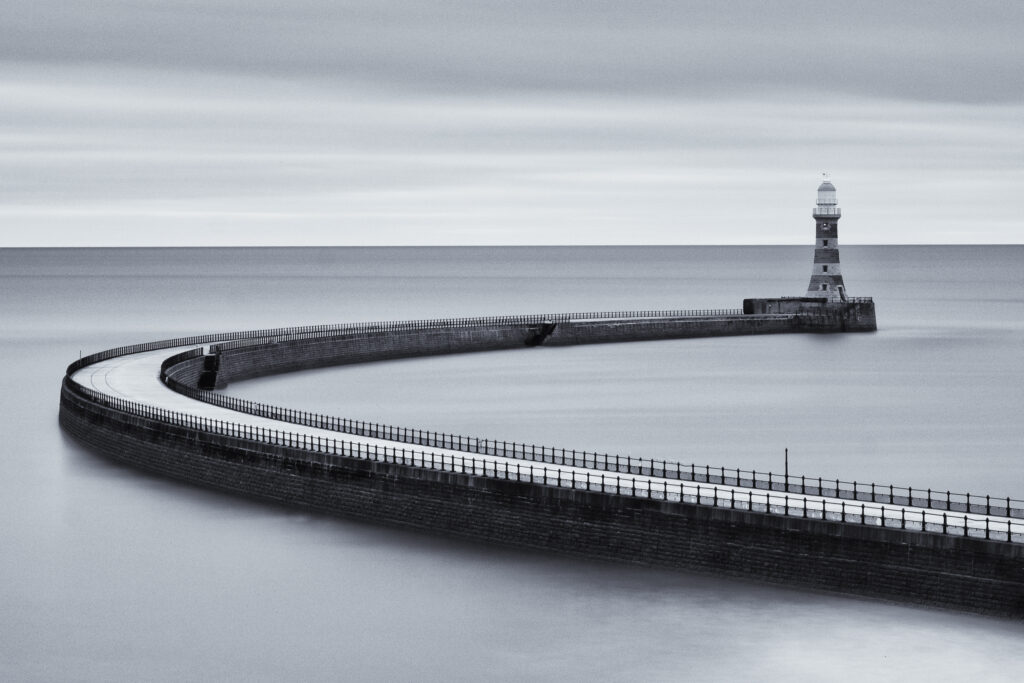 England, Tyne and Wear, Roker Pier. Roker Pier and Lighthouse located at the mouth of the River Wear in the city of Sunderland.