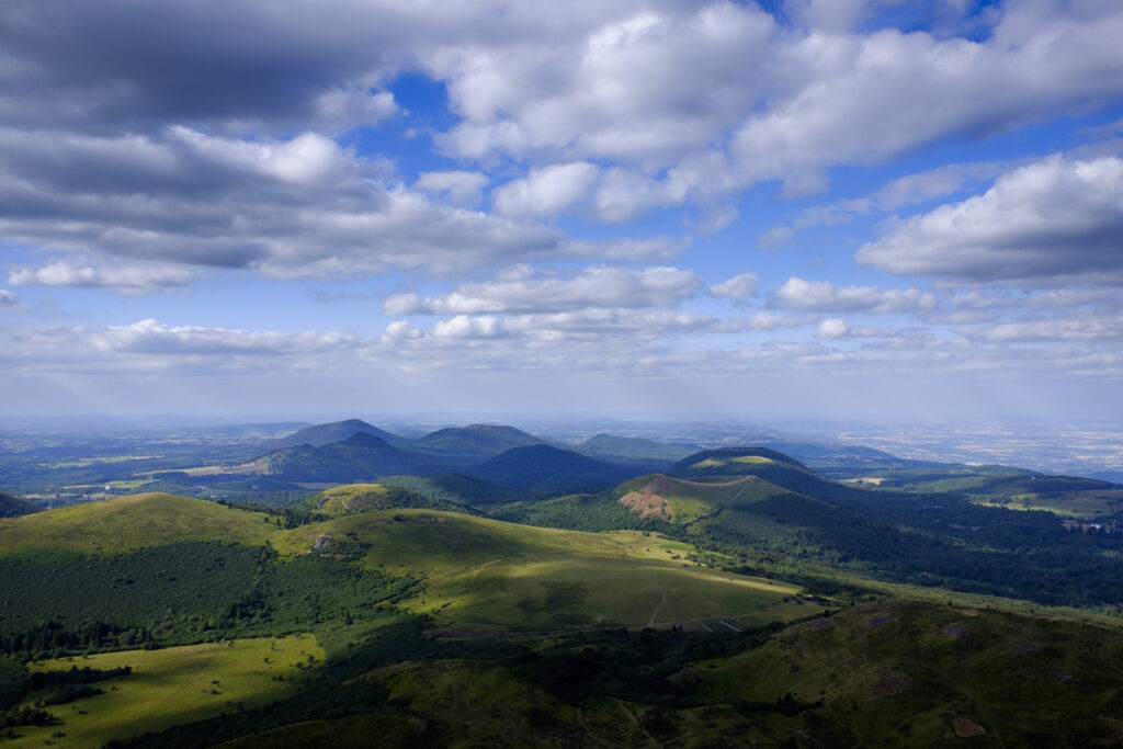France, Auvergne, Regional Nature Park of the Volcanoes of Auvergne. An elevated view of the Chaîne des Puys viewed from near the summit of Puy de Dôme.