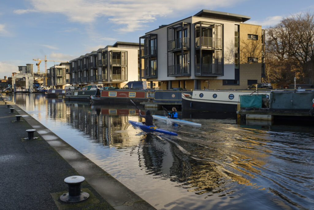 Scotland, Edinburgh, Union Canal. Canoeists and Canoes on the Union Canal near the Leamington Lift Bridge.